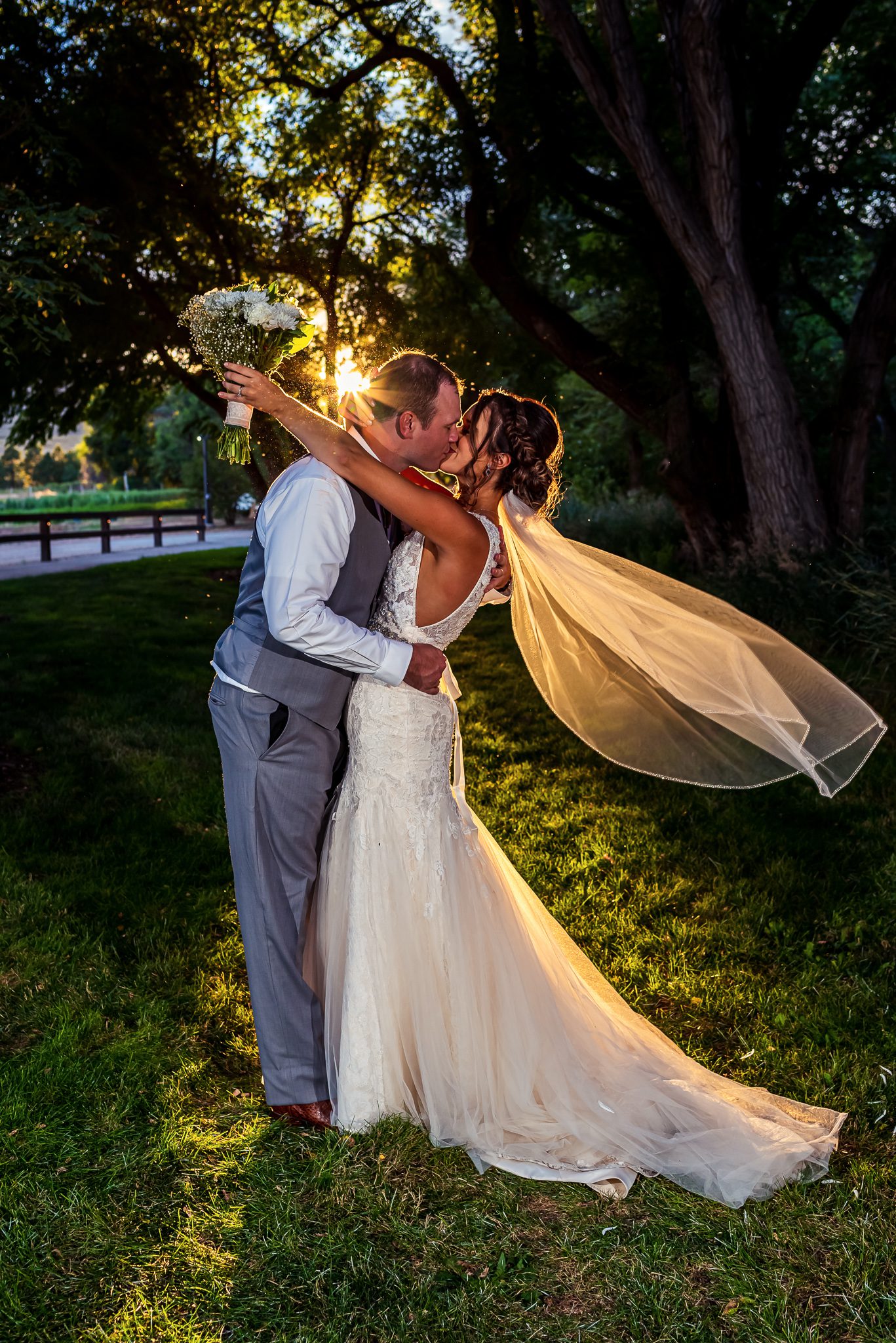a brides veil blows in the wind during golden hour at Denver Botanic Gardens Chatfield Farms