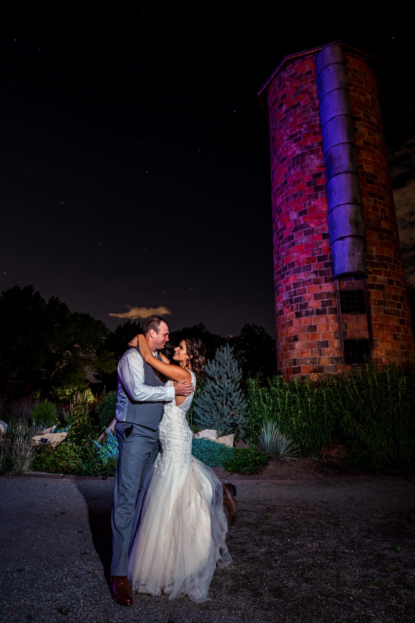 portrait of bride and groom at night outside Denver Botanic Gardens Chatfield Farms