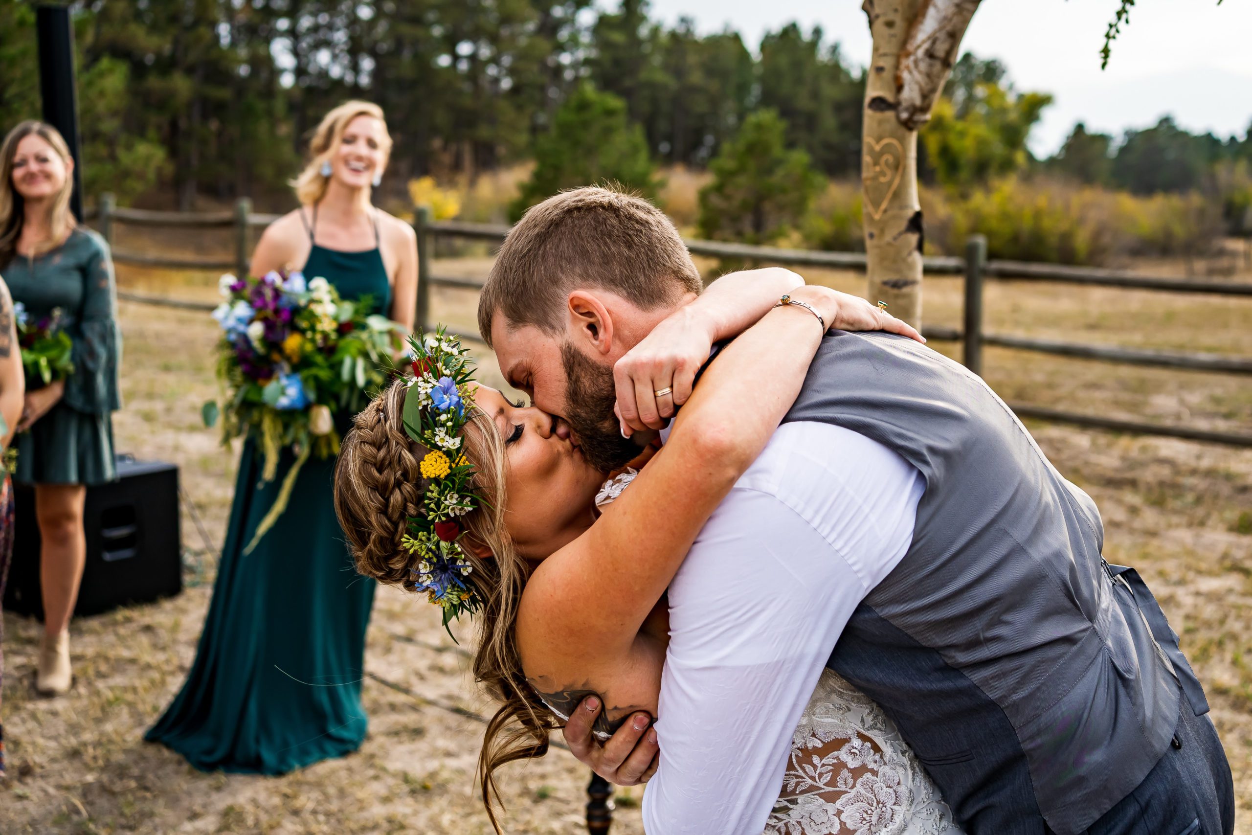 A bride and groom kiss at their backyard wedding in Colorado.