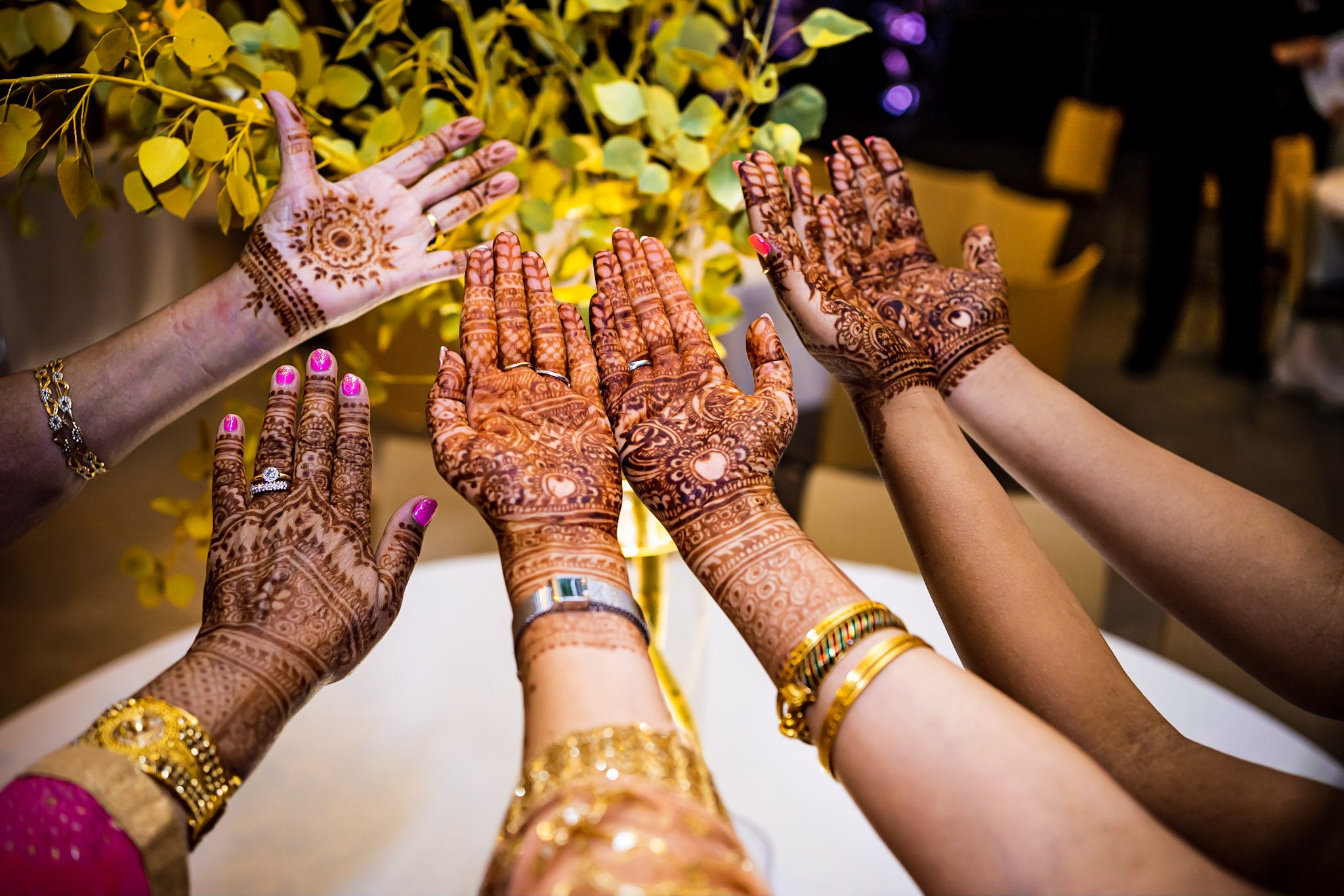 Colorful Southeast Asian wedding reception at the Aspen Meadows Resort in Aspen Colorado. Fall colors and fun dance party.