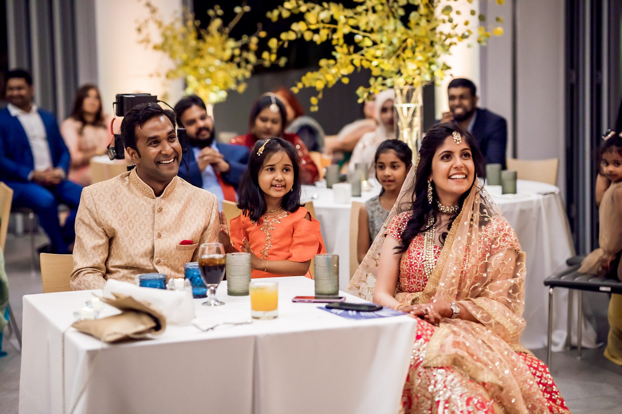 Colorful Southeast Asian wedding reception at the Aspen Meadows Resort in Aspen Colorado. Fall colors and fun dance party.