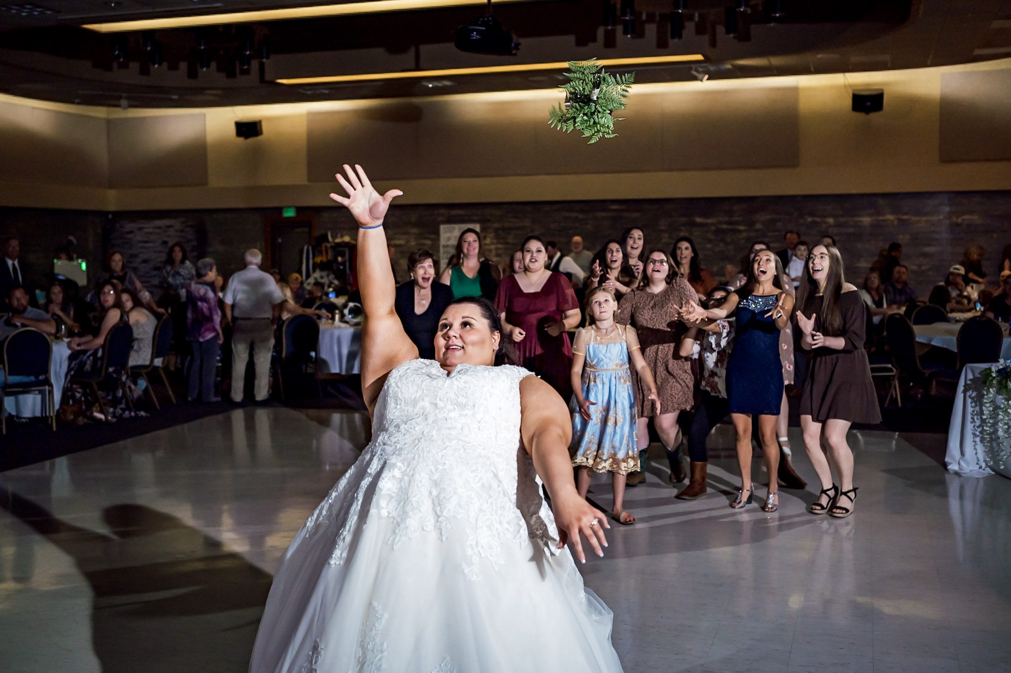 Bright and colorful wedding photography from a gorgeous Catholic Wedding Ceremony and the Sangre de Cristo Arts center in Pueblo Colorado